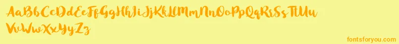 Blusty Script Free-fontti – oranssit fontit keltaisella taustalla