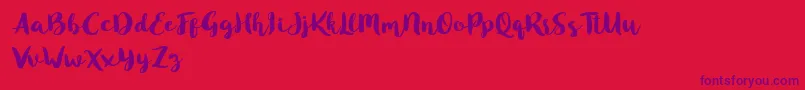 フォントBlusty Script Free – 赤い背景に紫のフォント