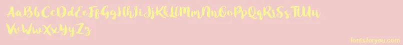 Blusty Script Free Font – Yellow Fonts on Pink Background