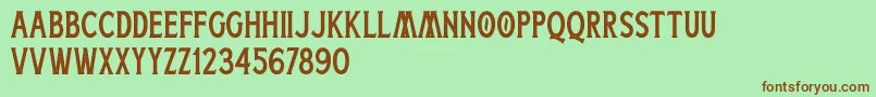 フォントBoatman Stamped Free Personal Use – 緑の背景に茶色のフォント