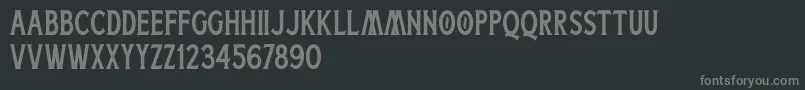 フォントBoatman Stamped Free Personal Use – 黒い背景に灰色の文字