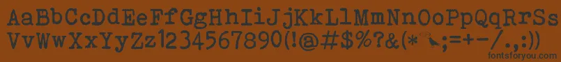 Czcionka Bohemian Typewriter – czarne czcionki na brązowym tle