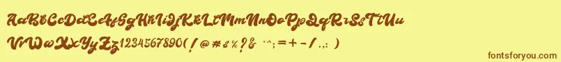 フォントBOLDIE – 茶色の文字が黄色の背景にあります。