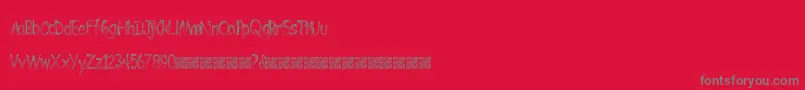 BombingStencil-Schriftart – Graue Schriften auf rotem Hintergrund