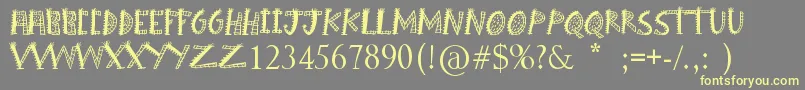 Шрифт Boom Shanker – жёлтые шрифты на сером фоне