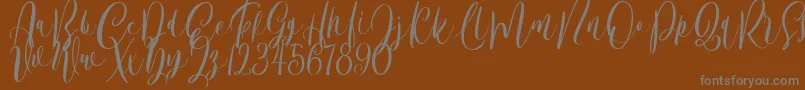 Bordellia Demo-Schriftart – Graue Schriften auf braunem Hintergrund