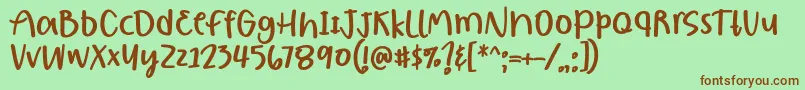 フォントBorjuis Font by 7NTypes – 緑の背景に茶色のフォント