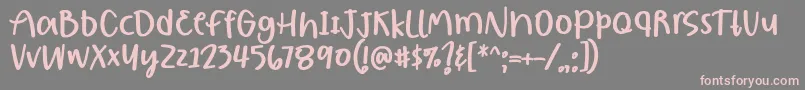 フォントBorjuis Font by 7NTypes – 灰色の背景にピンクのフォント