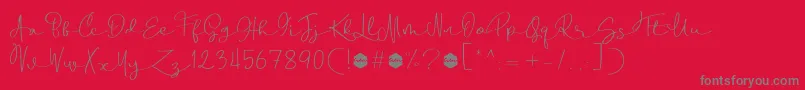 Czcionka Boulevard Script DEMO – szare czcionki na czerwonym tle
