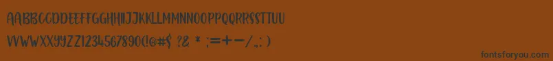 Шрифт BOUSTOWN SANS – чёрные шрифты на коричневом фоне