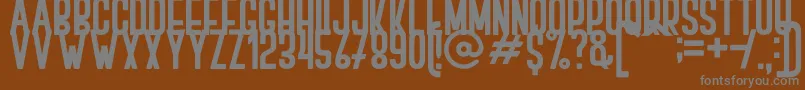 BOVEN 2-fontti – harmaat kirjasimet ruskealla taustalla