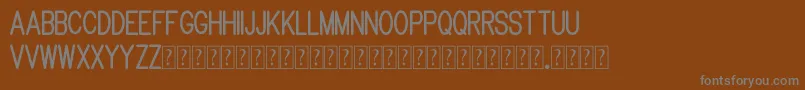 Шрифт Brandy mono typeface – серые шрифты на коричневом фоне