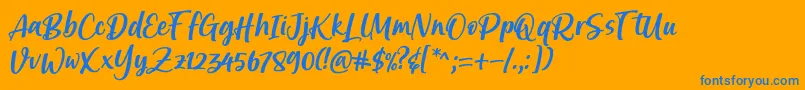 Brastagi Font by 7NTypes-Schriftart – Blaue Schriften auf orangefarbenem Hintergrund