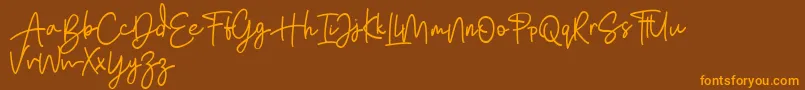 Bratarini FREE Font – Orange Fonts on Brown Background