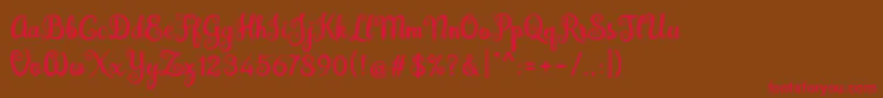 フォントBrazilian Script Fill – 赤い文字が茶色の背景にあります。