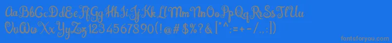 Brazilian Script Fill-fontti – harmaat kirjasimet sinisellä taustalla