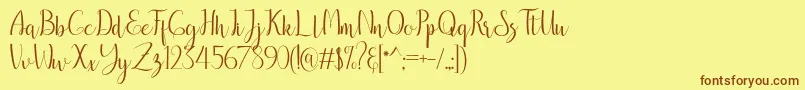 フォントbreathaking – 茶色の文字が黄色の背景にあります。