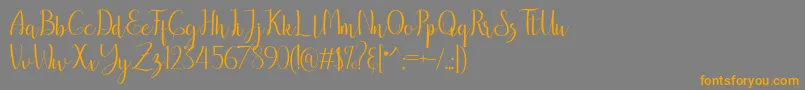 フォントbreathaking – オレンジの文字は灰色の背景にあります。