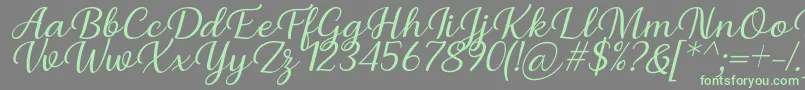 フォントBriany Font Regular Italic by Andrian 7NTypes – 灰色の背景に緑のフォント