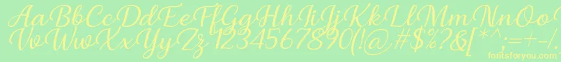 Czcionka Briany Font Regular Italic by Andrian 7NTypes – żółte czcionki na zielonym tle