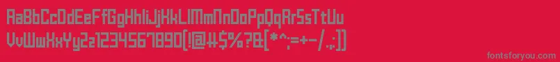 フォントBrickShapers – 赤い背景に灰色の文字