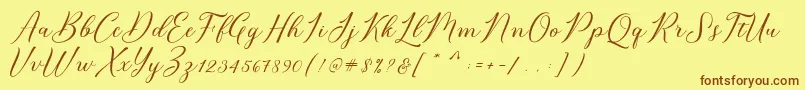 フォントBridget Script – 茶色の文字が黄色の背景にあります。