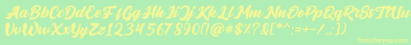 フォントBrigestScript – 黄色の文字が緑の背景にあります