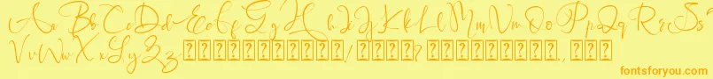 フォントBrigitta – オレンジの文字が黄色の背景にあります。