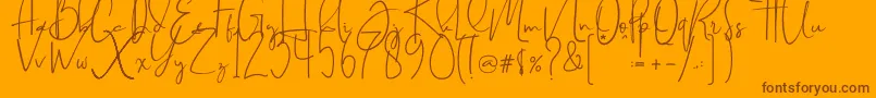 Czcionka Brilliant signature  regular – brązowe czcionki na pomarańczowym tle