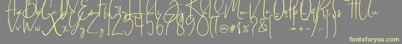 フォントBrilliant signature  regular – 黄色のフォント、灰色の背景