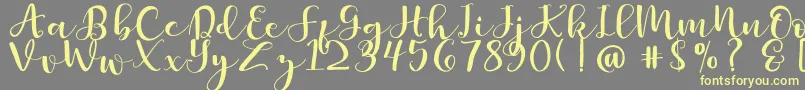 Britnees Font – Yellow Fonts on Gray Background