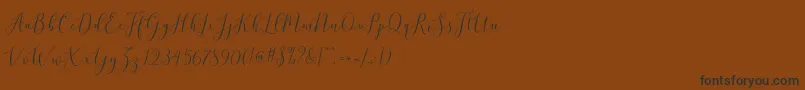 brittania script demo-Schriftart – Schwarze Schriften auf braunem Hintergrund