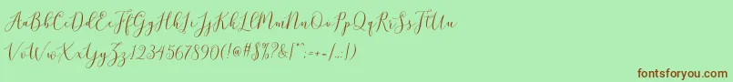 brittania script demo-Schriftart – Braune Schriften auf grünem Hintergrund