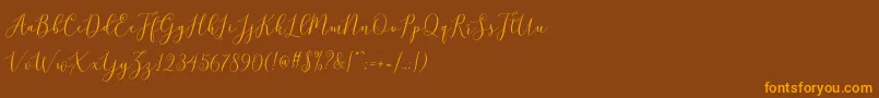 brittania script demo Font – Orange Fonts on Brown Background