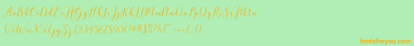 フォントbrittania script demo – オレンジの文字が緑の背景にあります。