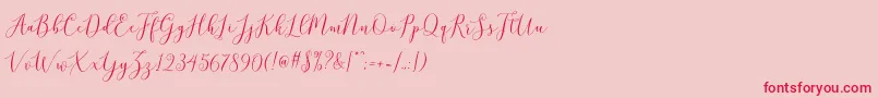 Fonte brittania script demo – fontes vermelhas em um fundo rosa