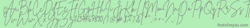 Fonte BrittanySignature – fontes cinzas em um fundo verde