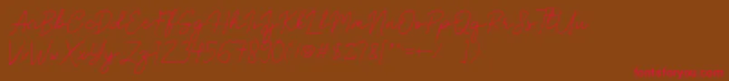 フォントBrittney Signature – 赤い文字が茶色の背景にあります。