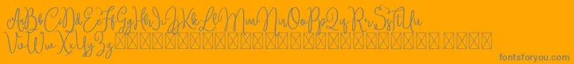 Czcionka Brittney – szare czcionki na pomarańczowym tle