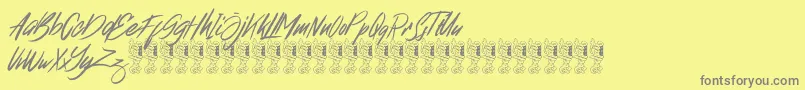フォントBroklight – 黄色の背景に灰色の文字