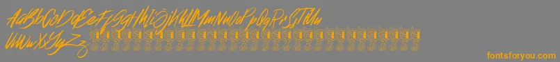 フォントBroklight – オレンジの文字は灰色の背景にあります。