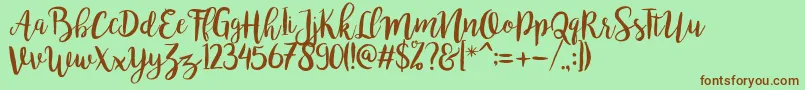 bromello Regular Font – Brown Fonts on Green Background