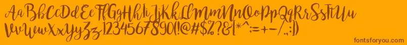 bromello Regular-fontti – ruskeat fontit oranssilla taustalla