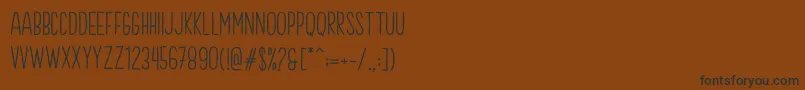 Brook Demo-Schriftart – Schwarze Schriften auf braunem Hintergrund