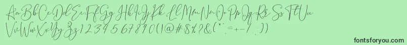 フォントBrooke Smith Script – 緑の背景に黒い文字
