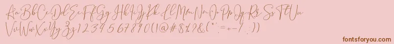 Fonte Brooke Smith Script – fontes marrons em um fundo rosa