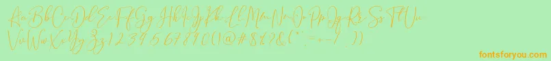 フォントBrooke Smith Script – オレンジの文字が緑の背景にあります。