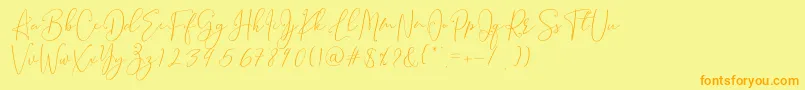フォントBrooke Smith Script – オレンジの文字が黄色の背景にあります。