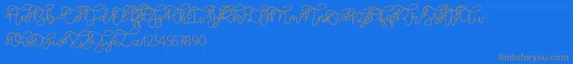 フォントBrooklyn script – 青い背景に灰色の文字