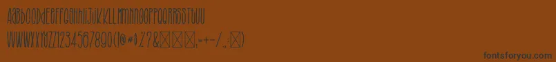 fuente BROUGHTTHESTYLE – Fuentes Negras Sobre Fondo Marrón
